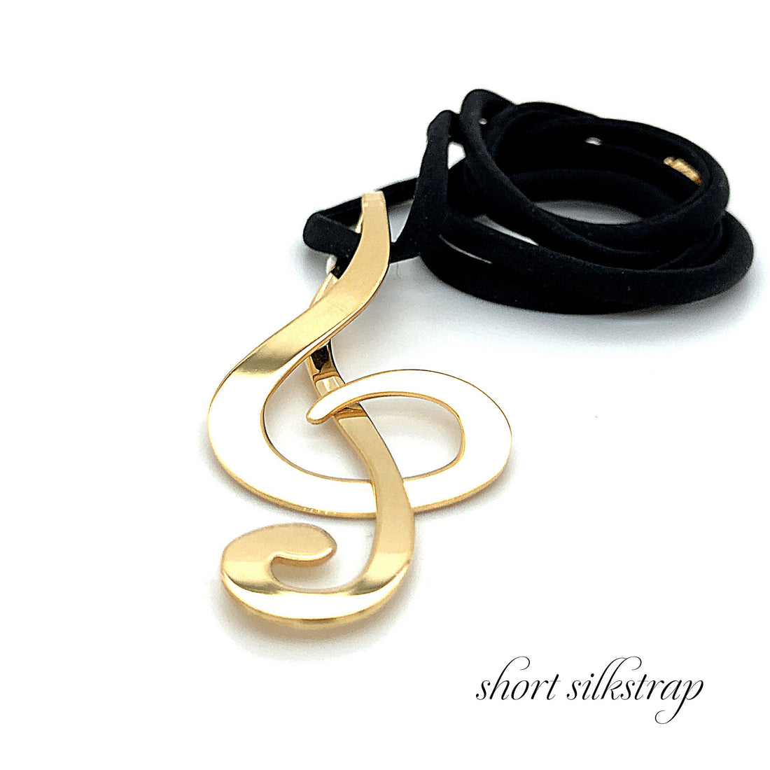 Chiavi G largo goldplated with short silkstrap.